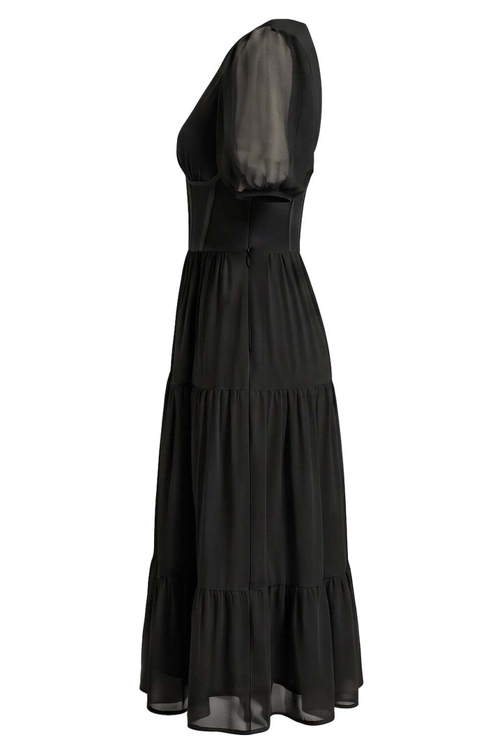 ELOISE puff sleeve corset midi dress in black on model - side view