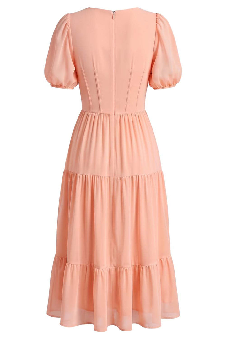 ELOISE puff sleeve corset midi dress in peach blush on model - back view