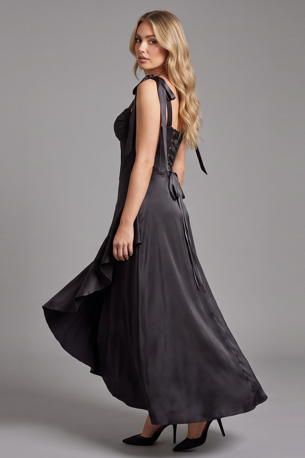 MIRCALLA Corset Midi Dress in Black on model – side view